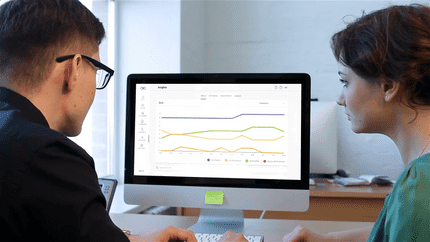 A woman at her computer exploring the Insights page of the Nulia Works website